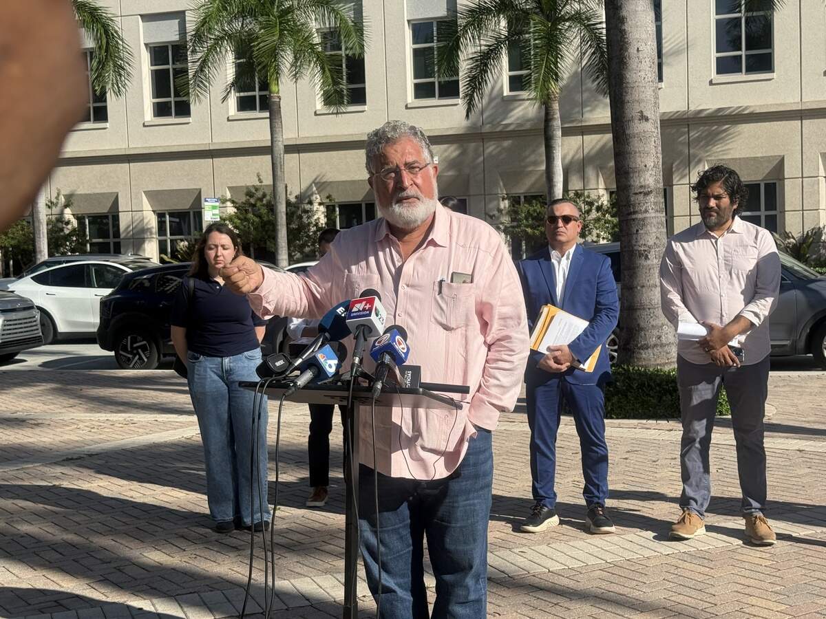 Former Congressman Joe Garcia denounces an immigration enforcement partnership with local police officers in Doral at a press conference on Oct. 7, 2026.